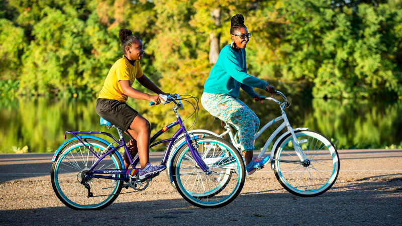 Outdoor photo of two female bicycle riders